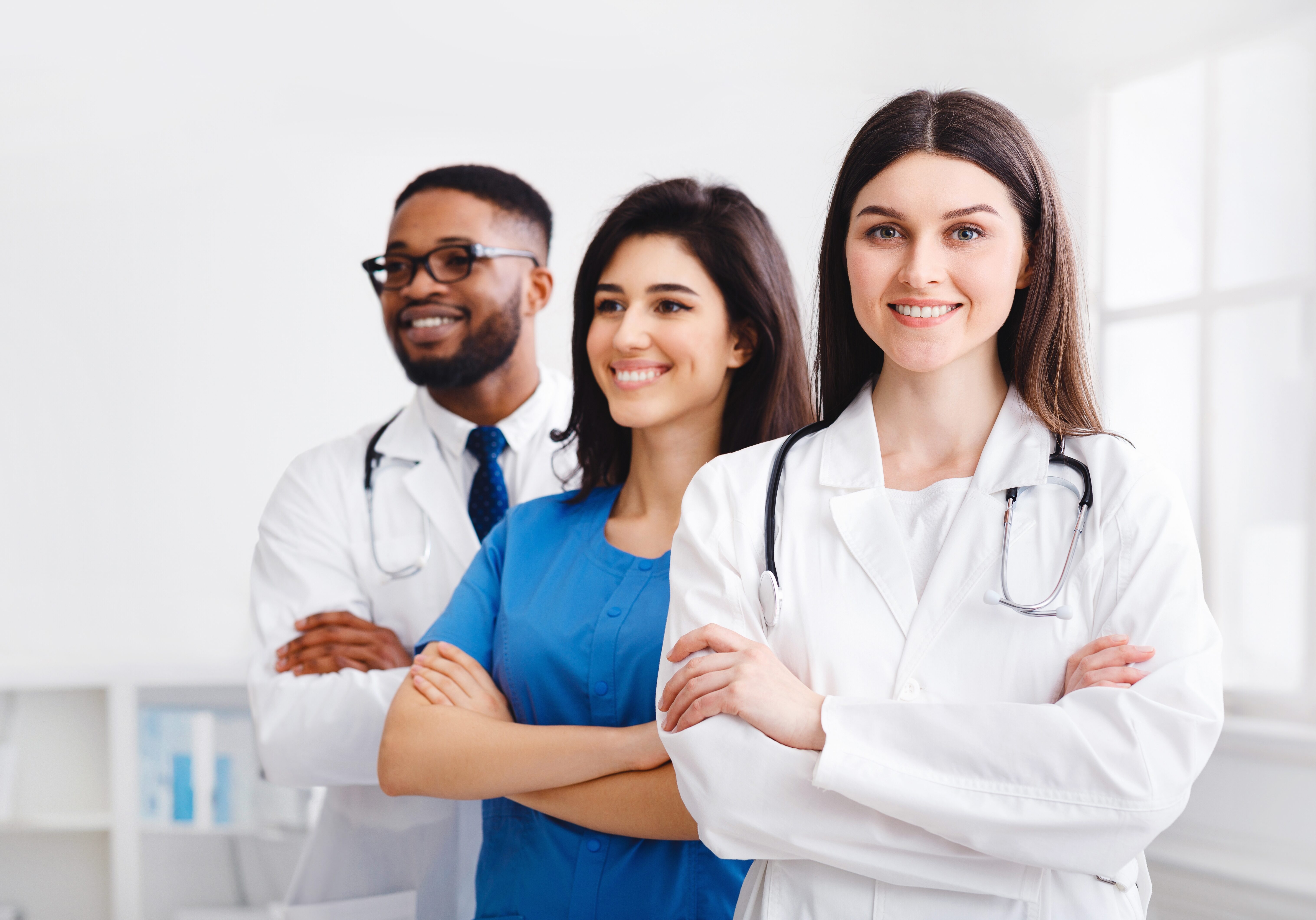 Tem,Of,Confident,Doctors,And,Interns,Standing,In,Hospital,With